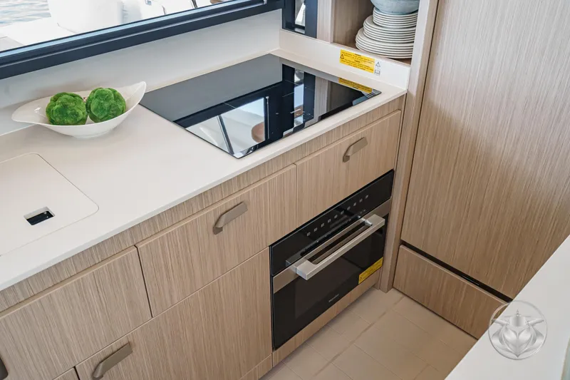 Slide: The Image of Modern kitchen in Prestige F4.9 yacht, featuring sleek appliances and elegant cabinetry, 2025 model. - 28