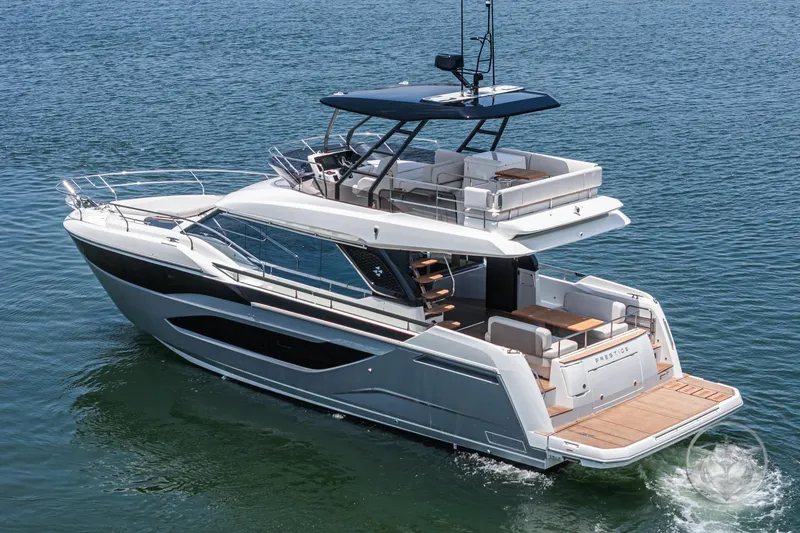 Slide: The Image of Luxury 2025 Prestige F4.9 yacht cruising on open water, showcasing sleek design and spacious deck. - 3
