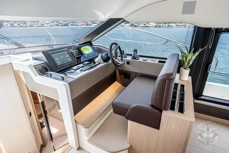Slide: The Image of Luxurious 2025 Prestige F4.9 yacht interior with modern helm and navigation systems. - 32