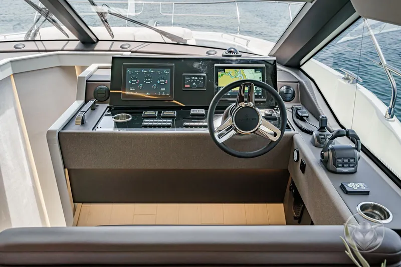 Slide: The Image of Helm of 2025 Prestige F4.9 yacht with advanced navigation and control systems. - 33