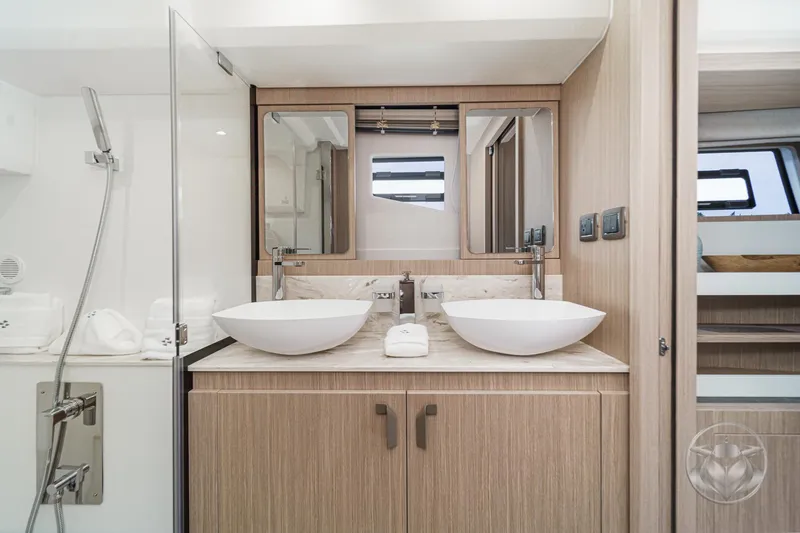 Slide: The Image of Luxurious bathroom interior of 2025 Prestige F4.9 yacht with dual sinks and modern fixtures. - 37