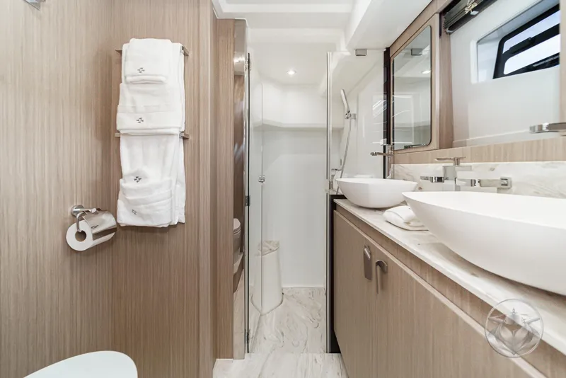Slide: The Image of Luxurious bathroom in 2025 Prestige F4.9 yacht with dual sinks and modern fixtures. - 38