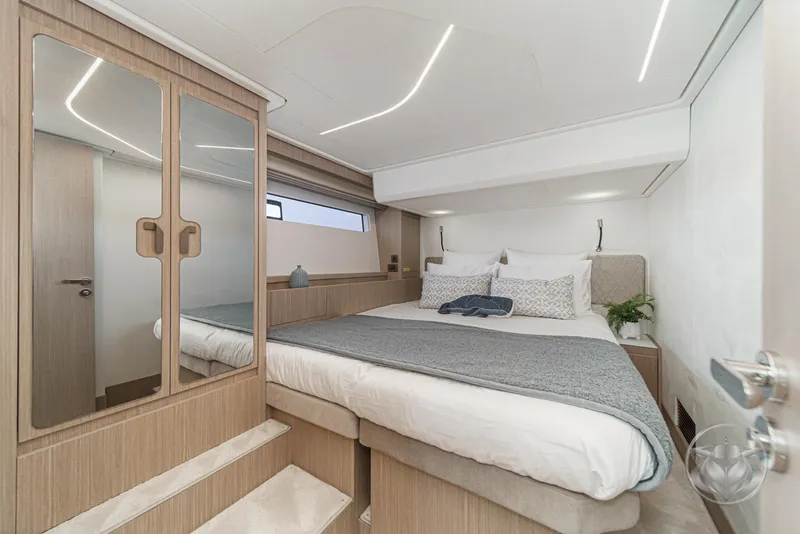 Slide: The Image of Luxurious cabin interior of 2025 Prestige F4.9 yacht with modern design and cozy bedding. - 39