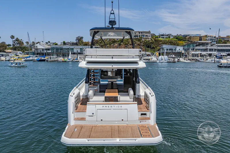 Slide: The Image of Luxury Prestige F4.9 yacht, 2025 model, docked in a scenic marina. - 4