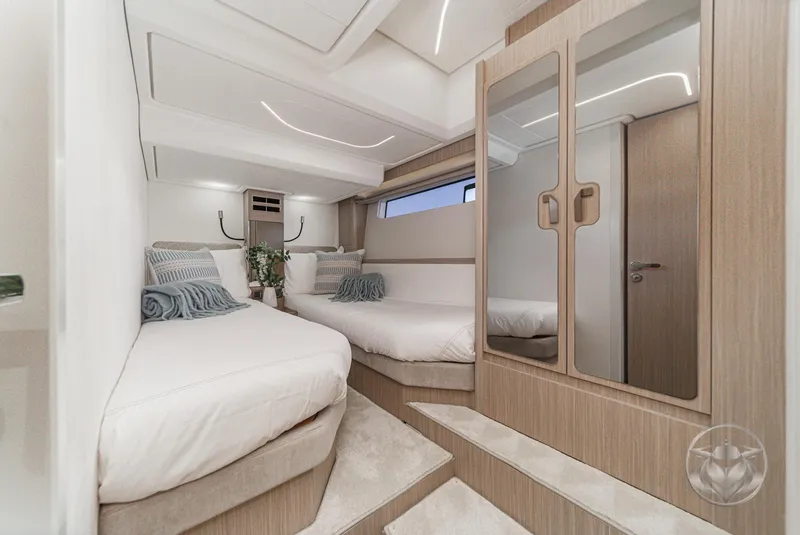 Slide: The Image of Luxurious interior of 2025 Prestige F4.9 yacht with twin beds and modern decor. - 40