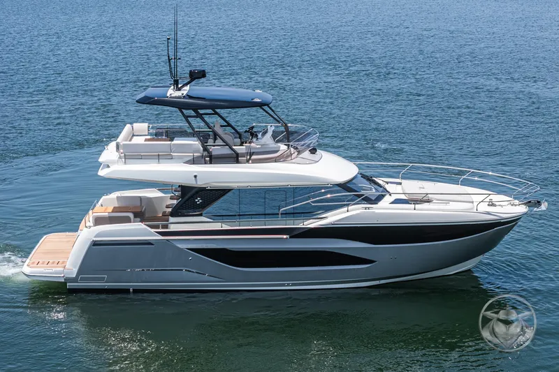 Slide: The Image of 2025 Prestige F4.9 yacht cruising on open water, showcasing sleek design and luxury features. - 6