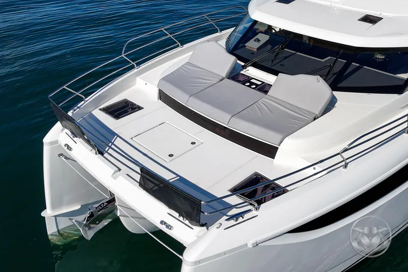 Slide: The Image of Prestige M48 2026 yacht with sleek design and spacious deck on calm water. - 18