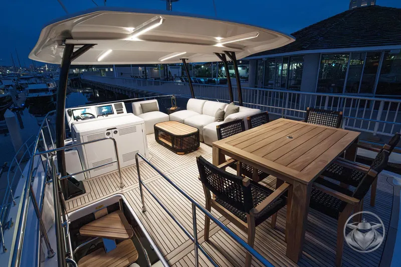 Slide: The Image of Luxurious Prestige M48 yacht deck with elegant seating and dining area, 2026 model. - 22