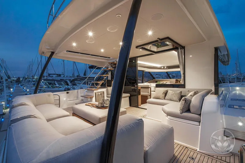 Slide: The Image of Luxurious 2026 Prestige M48 yacht interior with elegant seating and ambient lighting at dusk. - 28