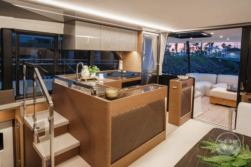 Slide: The Image of Luxurious interior of 2026 Prestige M48 yacht with modern kitchen and seating area at sunset. - 35