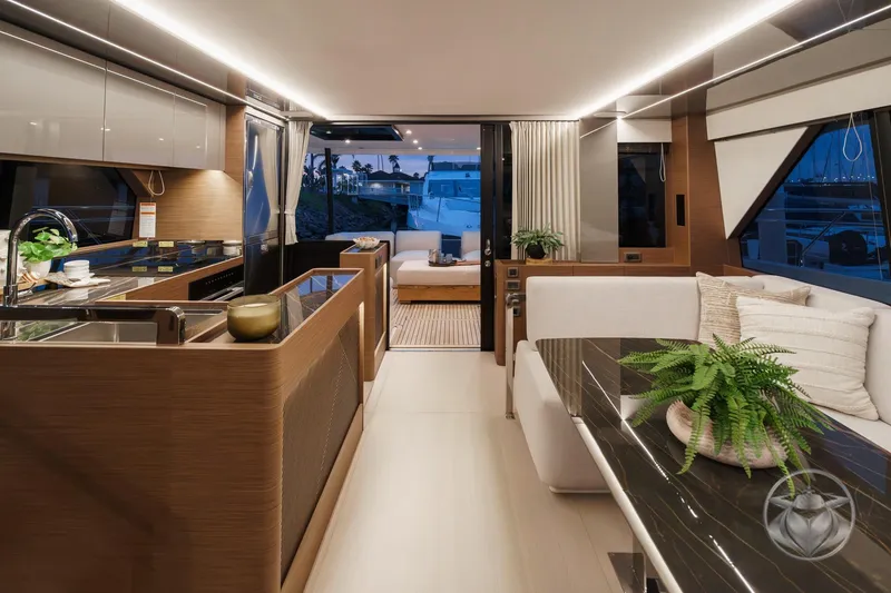Slide: The Image of Luxurious interior of 2026 Prestige M48 yacht with modern kitchen and elegant seating area. - 36