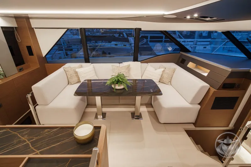 Slide: The Image of Luxurious interior of 2026 Prestige M48 yacht with elegant seating and modern decor. - 38