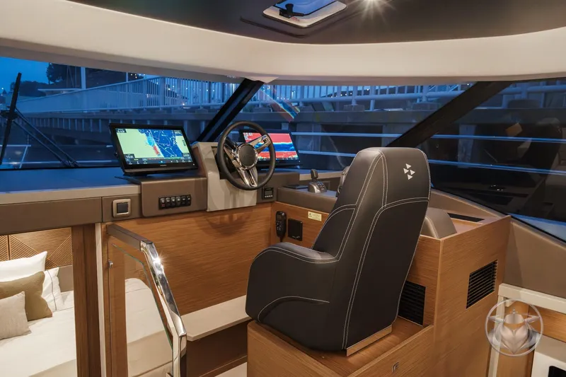 Slide: The Image of Interior of 2026 Prestige M48 yacht cockpit with modern navigation systems and luxurious seating. - 39