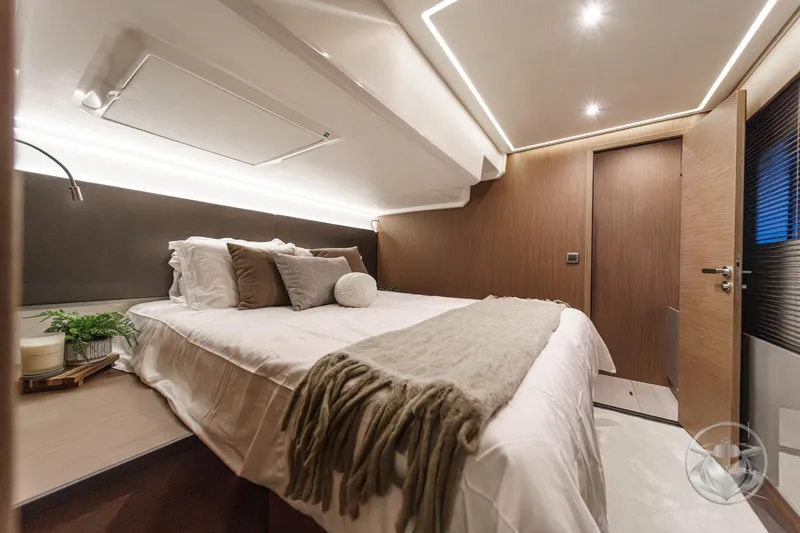 Slide: The Image of Luxurious bedroom interior of 2026 Prestige M48 yacht with modern design and ambient lighting. - 42