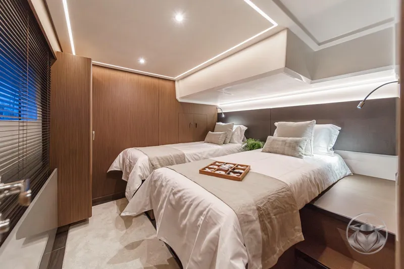 Slide: The Image of Luxurious cabin interior of 2026 Prestige M48 yacht with twin beds and modern lighting. - 47