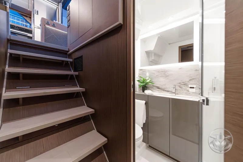 Slide: The Image of Modern interior of 2026 Prestige M48 yacht with sleek staircase and elegant bathroom. - 48