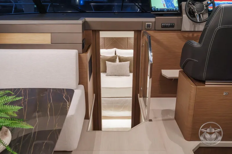 Slide: The Image of Luxurious interior of 2026 Prestige M48 yacht with modern seating and navigation area. - 51