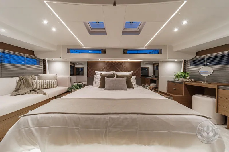 Slide: The Image of Luxurious interior of 2026 Prestige M48 yacht with elegant bedding and modern decor. - 53