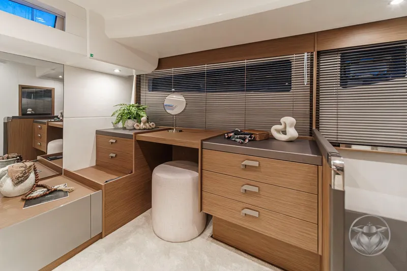 Slide: The Image of Luxurious interior of 2026 Prestige M48 yacht with elegant wooden cabinetry and modern decor. - 56