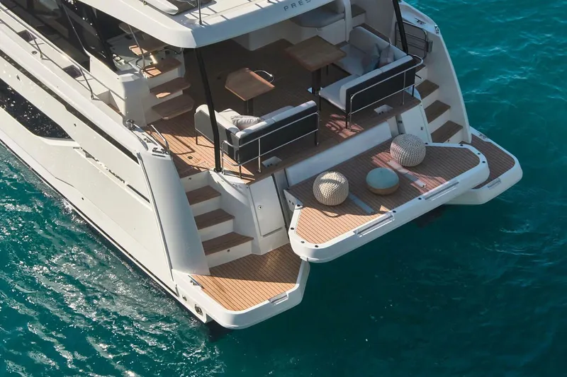 Slide: The Image of Luxury 2026 Prestige M48 yacht cruising on calm blue waters. - 6