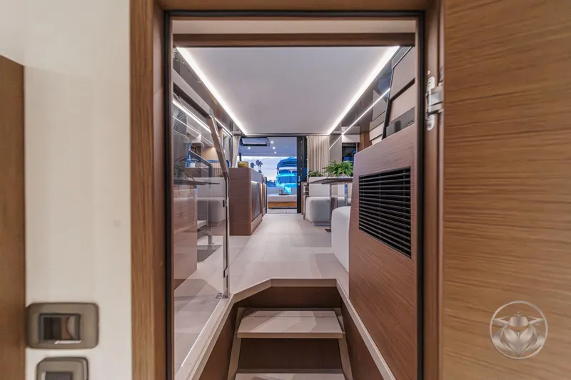 Slide: The Image of Interior view of 2026 Prestige M48 yacht, featuring modern design and elegant wood finishes. - 63