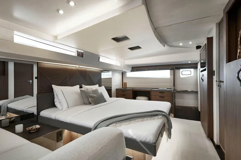 Slide: The Image of 2026 Prestige M48 yacht cruising on calm blue waters. - 9