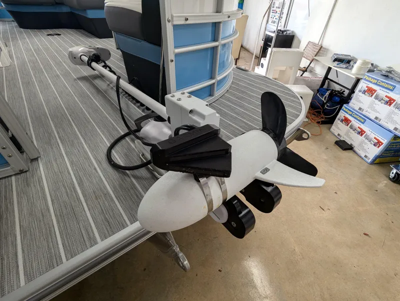 Slide: The Image of 2025 Trifecta CS 22RFC boat with a mounted trolling motor on deck. - 16