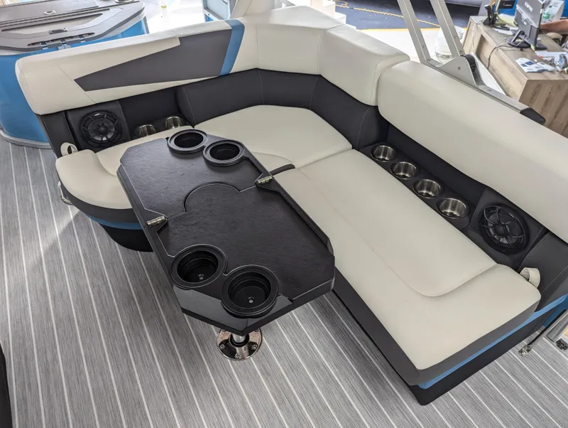 Slide: The Image of Luxurious seating area on 2025 Trifecta CS 22RFC boat with cup holders and speakers. - 18