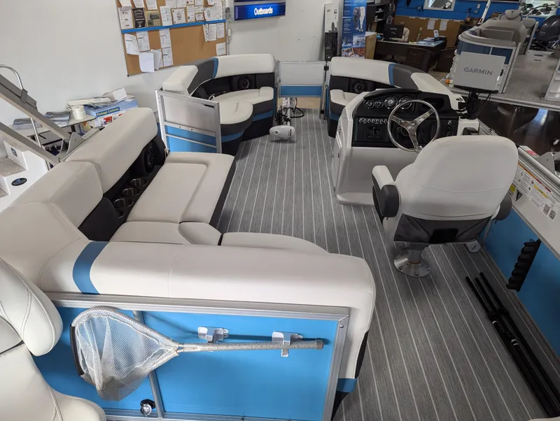 Slide: The Image of 2025 Trifecta CS 22RFC pontoon boat interior with plush seating and modern dashboard. - 20