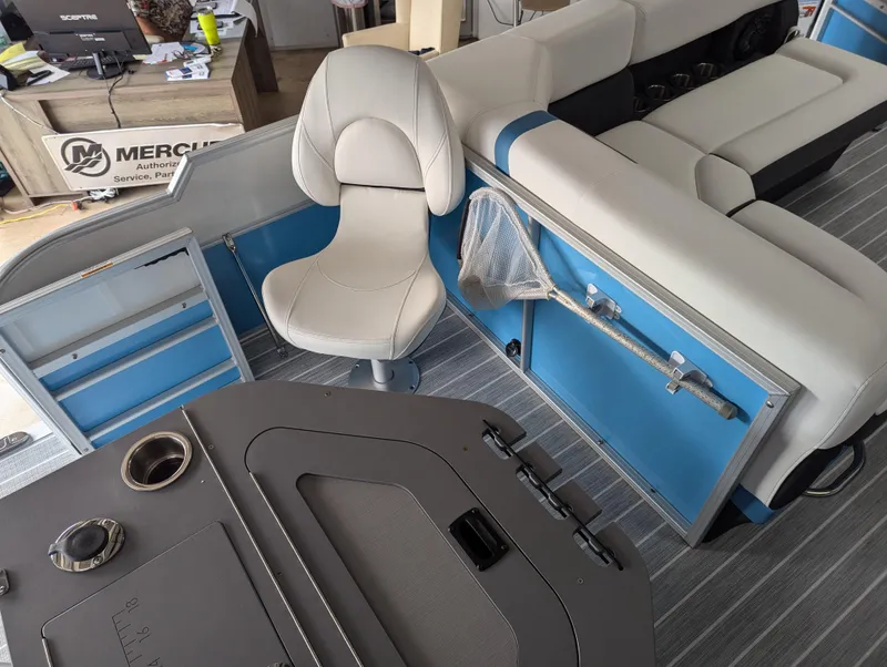 Slide: The Image of 2025 Trifecta CS 22RFC boat interior with seating and fishing gear. - 21