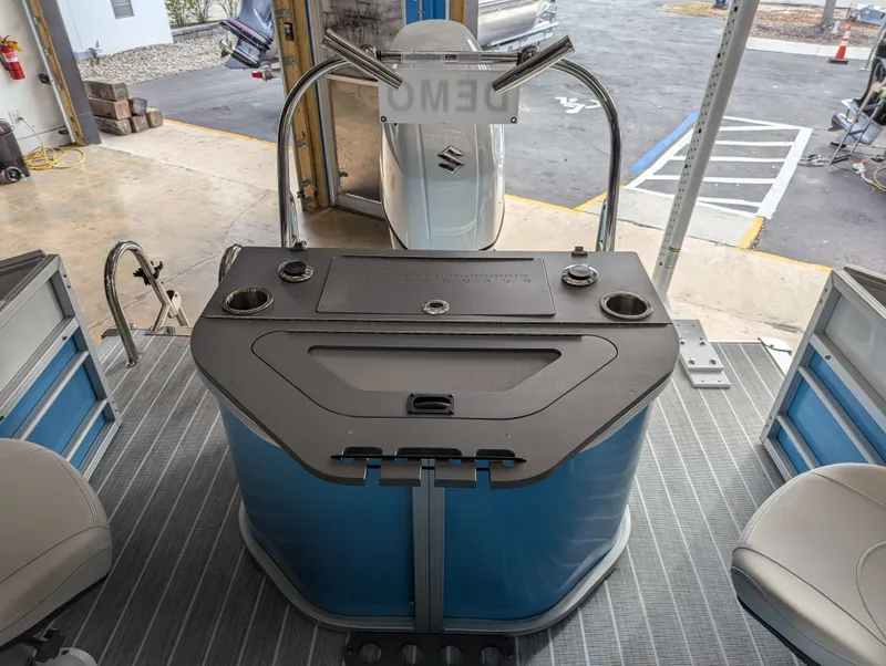 Slide: The Image of 2025 Trifecta CS 22RFC boat interior with helm and seating area. - 22