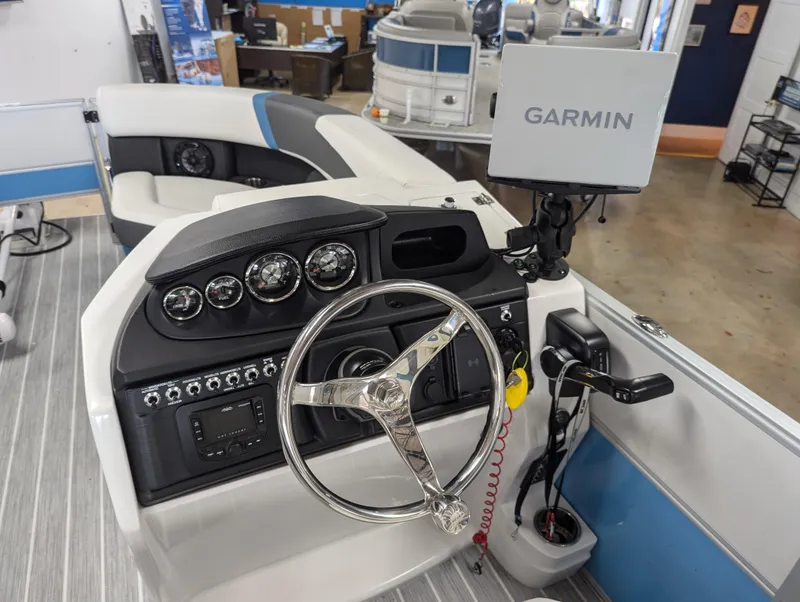 Slide: The Image of 2025 Trifecta CS 22RFC boat dashboard with Garmin navigation system. - 8