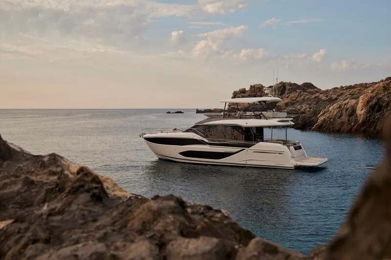 Slide: The Image of Luxury 2026 Prestige F5.7 yacht with elegant deck seating and modern design. - 2
