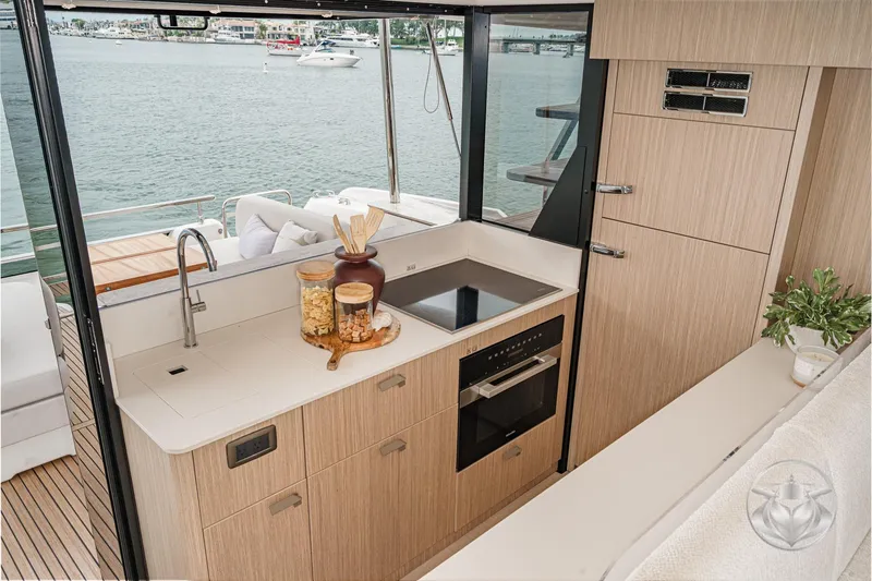 Slide: The Image of Modern kitchen on Prestige F5.7 yacht, 2026 model, with sleek design and waterfront view. - 36