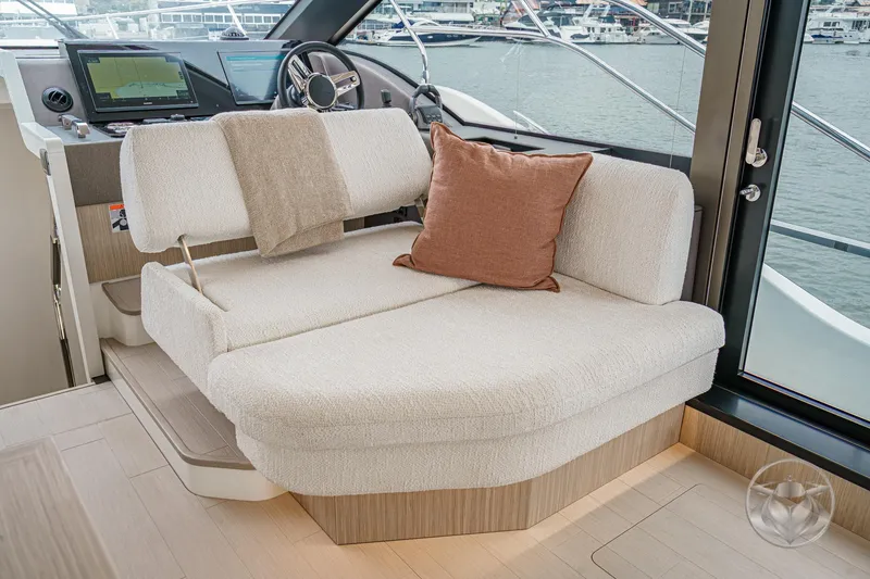 Slide: The Image of Luxurious interior of 2026 Prestige F5.7 yacht with plush seating and modern helm. - 40