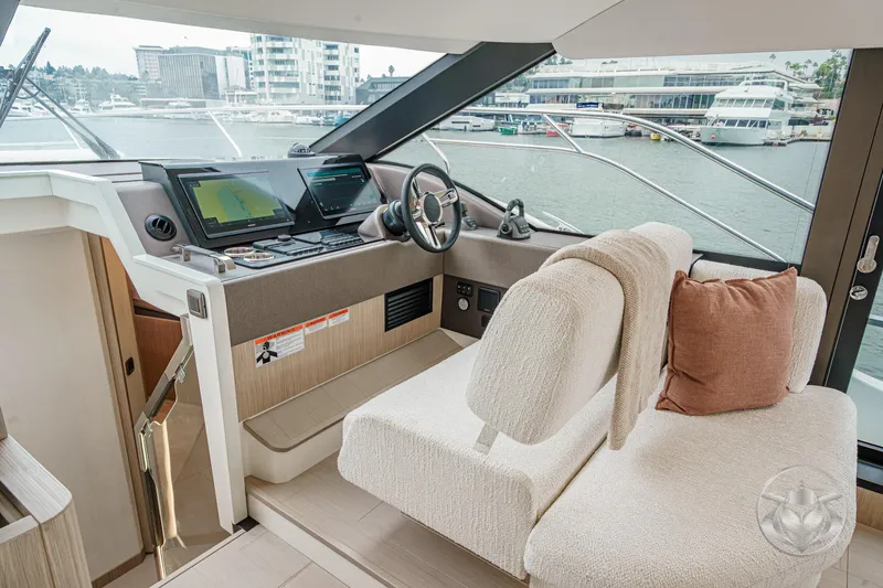 Slide: The Image of Luxurious 2026 Prestige F5.7 yacht interior with modern helm and plush seating. - 41
