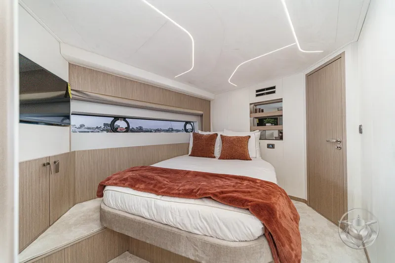 Slide: The Image of Luxurious bedroom interior of 2026 Prestige F5.7 yacht with modern design and cozy bedding. - 47