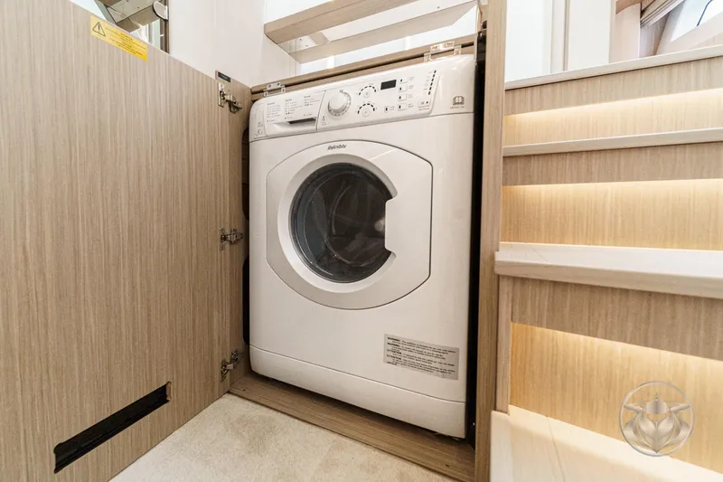 Slide: The Image of Front-loading washing machine in wooden cabinet, Prestige F5.7 model, 2026. - 52