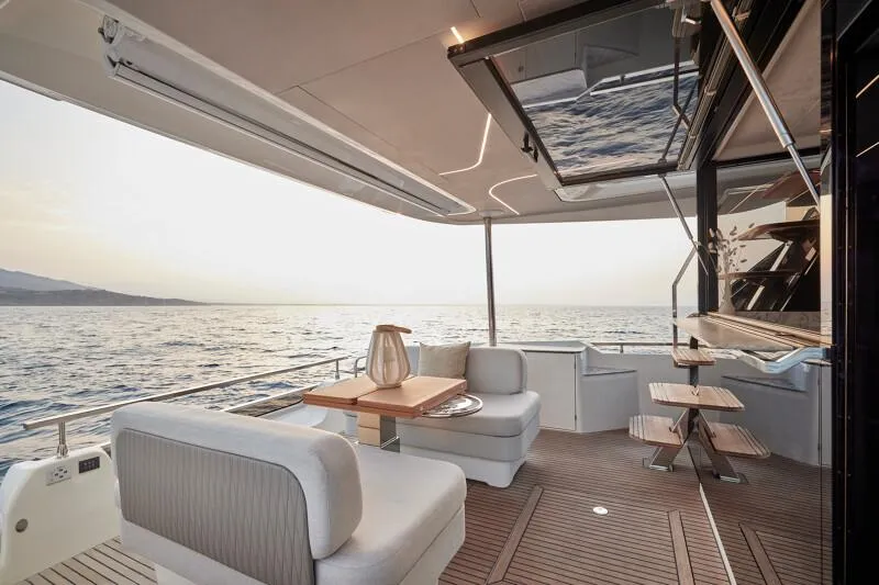 Slide: The Image of 2026 Prestige F5.7 yacht on calm water, showcasing sleek design and modern features. - 8