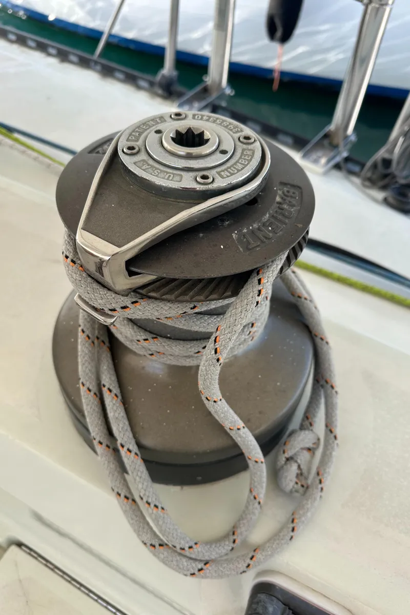 Slide: The Image of Sailboat winch with rope on a 1986 C&C 41 yacht deck. - 13
