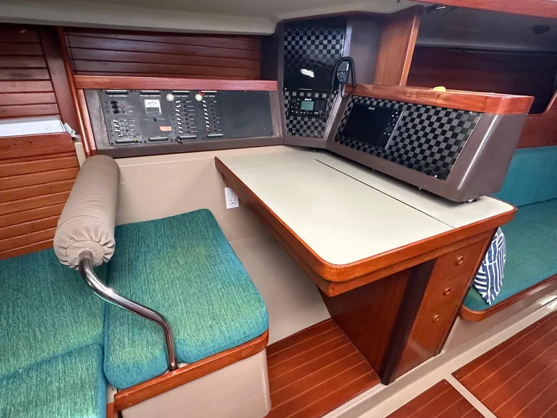 Slide: The Image of Interior of 1986 C&C 41 sailboat with navigation station and seating area. - 18