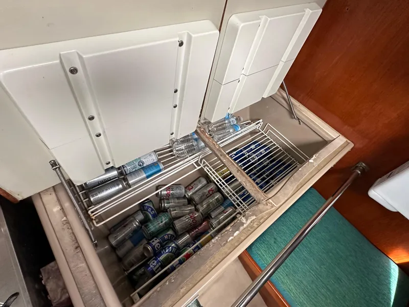 Slide: The Image of Refrigerator in 1986 C&C 41 yacht, stocked with beverages. - 31
