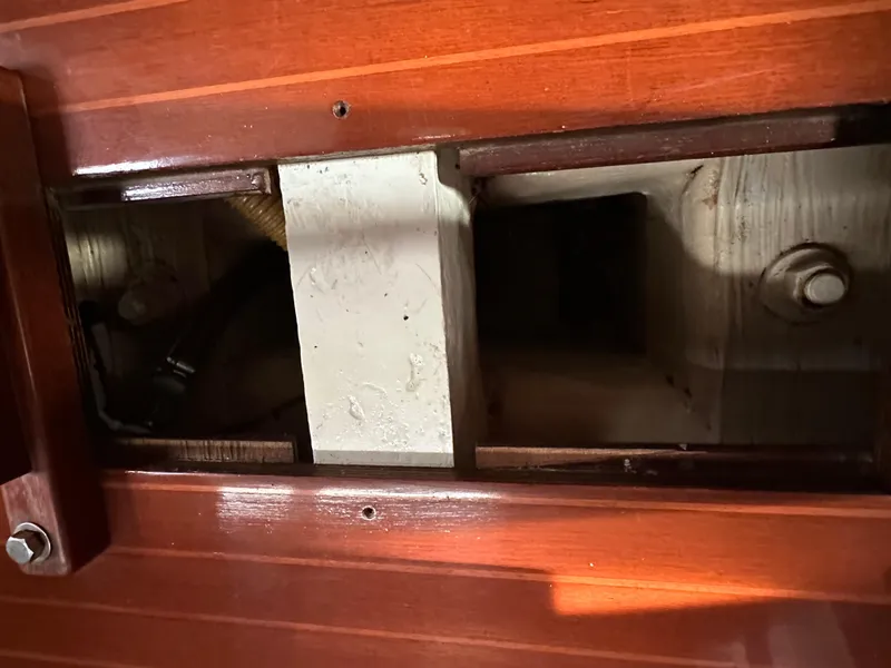 Slide: The Image of Interior view of 1986 C&C 41 yacht showing wooden paneling and structural components. - 32