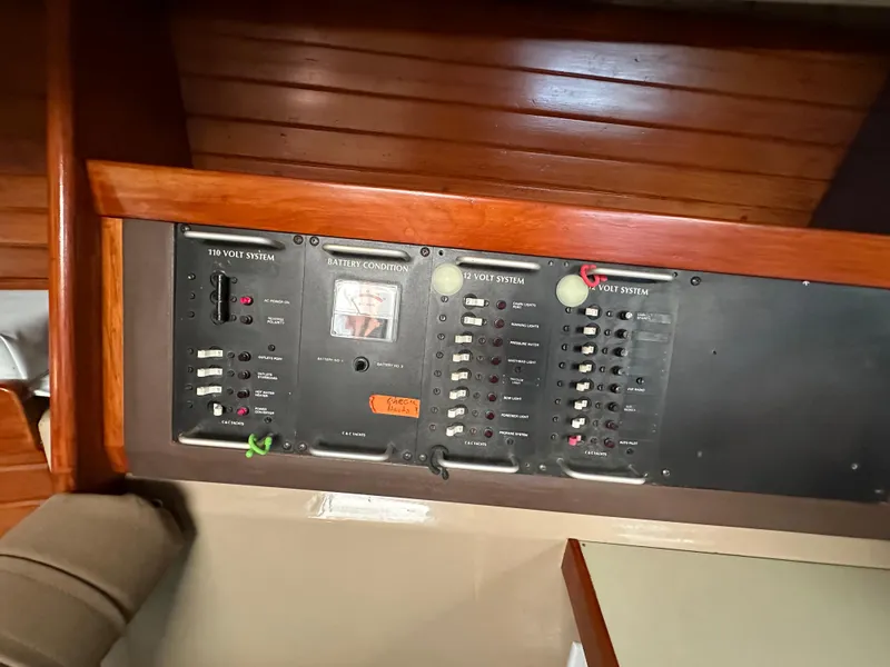 Slide: The Image of Electrical control panel on a 1986 C&C 41 sailboat, featuring various switches and indicators. - 34