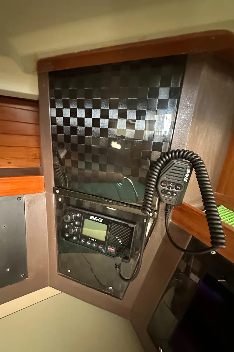 Slide: The Image of 1986 C&C 41 yacht interior with radio communication equipment. - 38