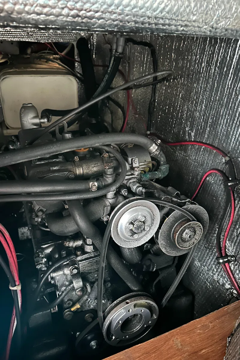 Slide: The Image of Engine compartment of a 1986 C&C 41 sailboat with visible belts and hoses. - 39