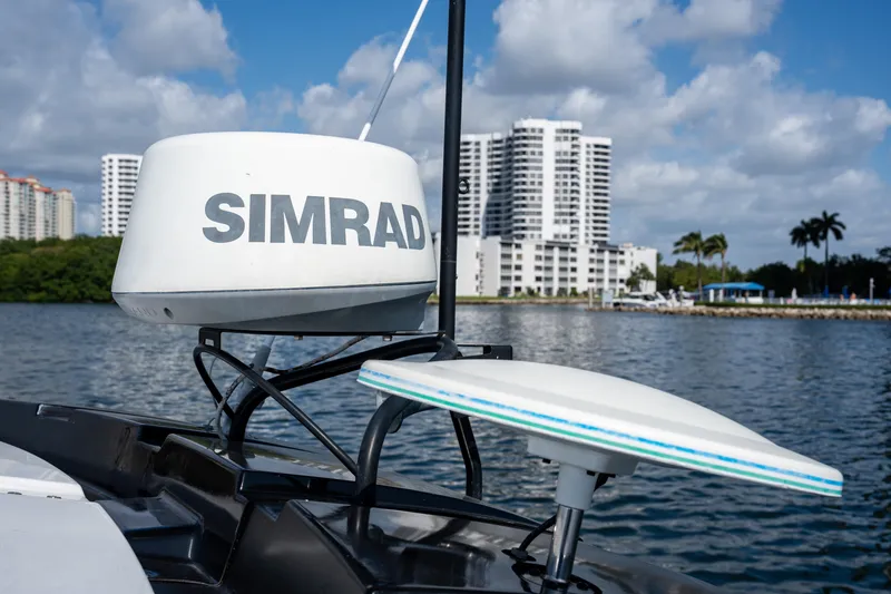 Slide: The Image of Simrad radar on 2017 Beneteau Gran Turismo 40, with cityscape and water backdrop. - 16