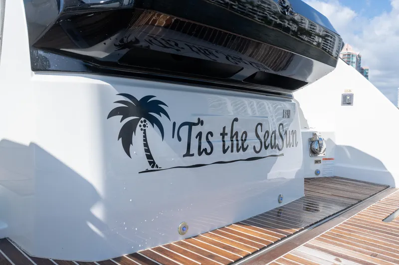 Slide: The Image of Beneteau Gran Turismo 40 yacht, 2017, with "Tis the SeaSun" name and palm tree graphic. - 18