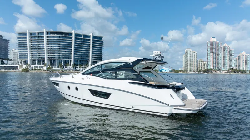 Slide: The Image of 2017 Beneteau Gran Turismo 40 yacht on water with city skyline background. - 19