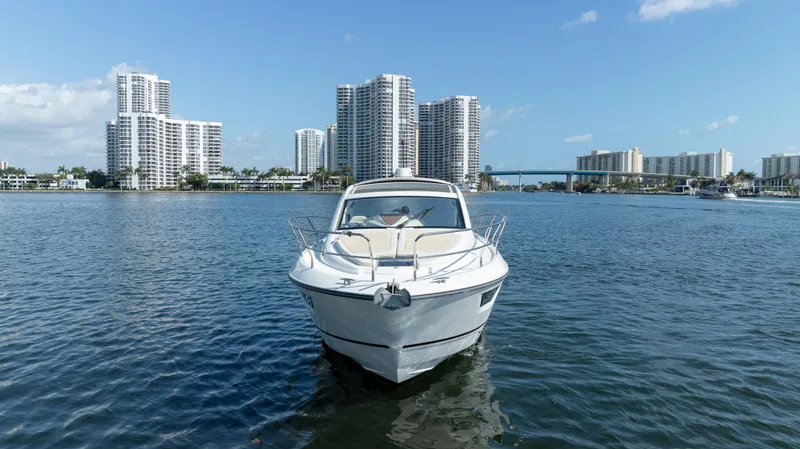 Slide: The Image of Beneteau Gran Turismo 40 yacht on water with city skyline, 2017 model. - 21